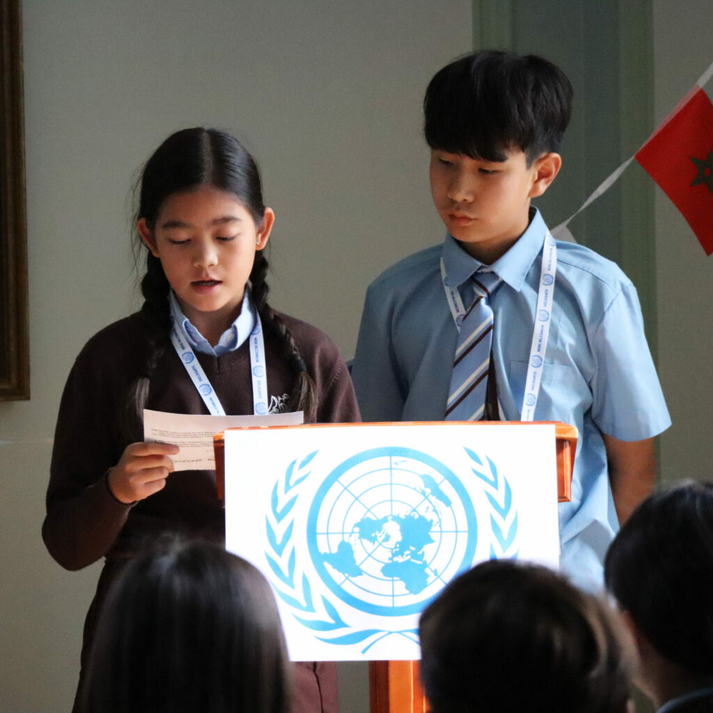 Students sharing ideas and resolutions at our Model United Nations Conference